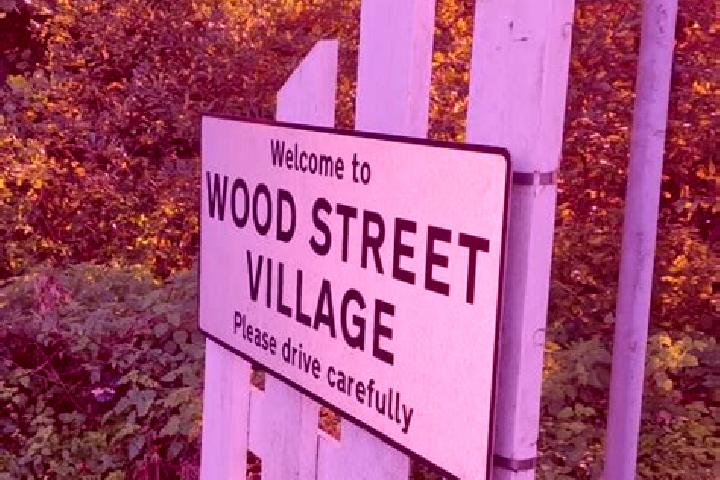 escort Wood Street Village